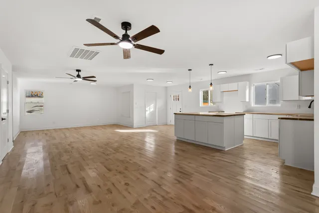 a view of kitchen with wooden floor and windows