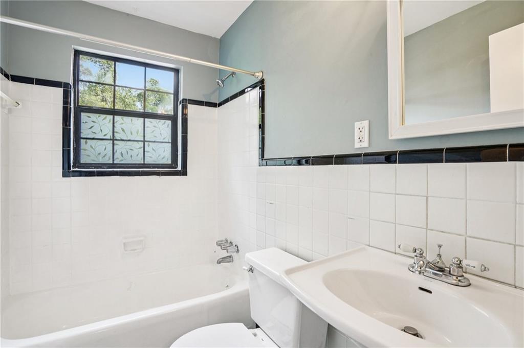 890 Glendale Terrace Northeast, Unit 1 Atlanta, GA 30309 - Photo 16 of 19 a bathroom with a sink and a bathtub