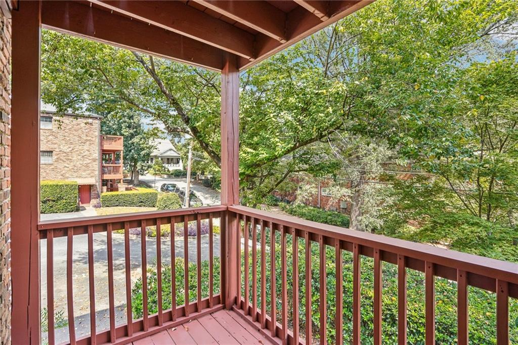 890 Glendale Terrace Northeast, Unit 1 Atlanta, GA 30309 - Photo 17 of 19 a view of a balcony with wooden floor