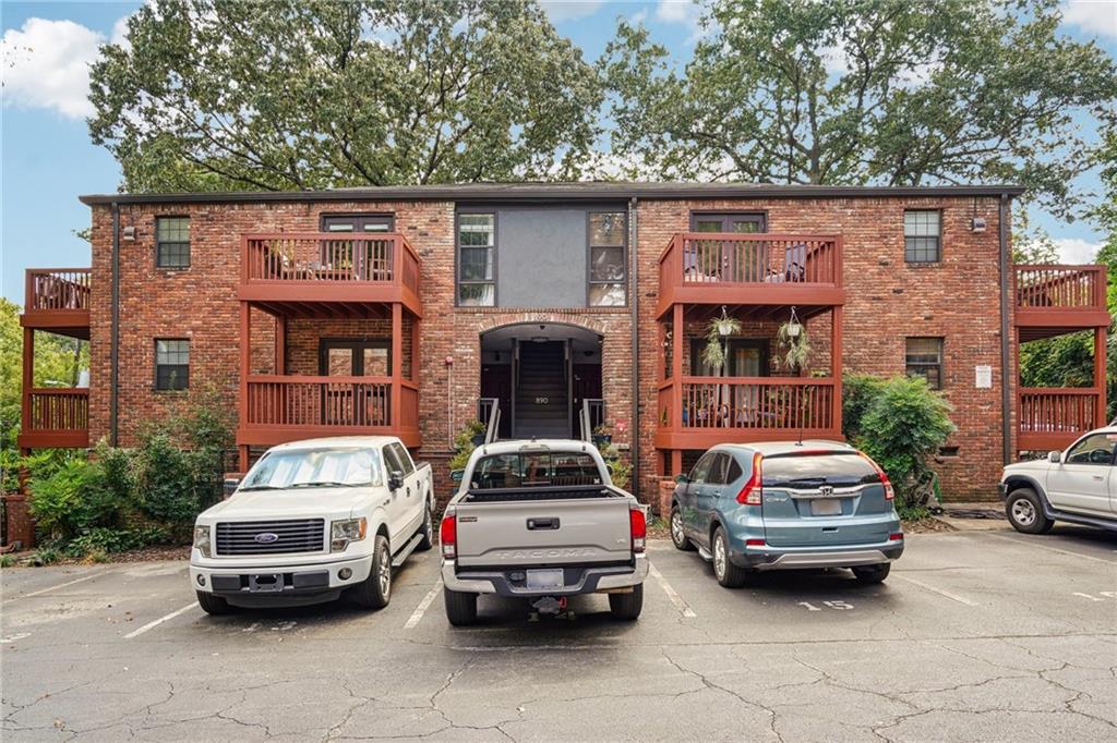 890 Glendale Terrace Northeast, Unit 1 Atlanta, GA 30309 - Photo 19 of 19 a car parked in front of a house