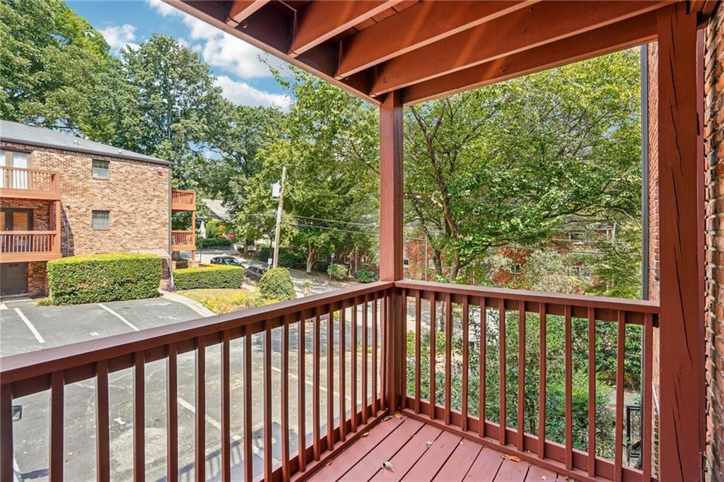 890 Glendale Terrace Northeast, Unit 1 Atlanta, GA 30309 - Photo 6 of 19 a view of a balcony with wooden floor