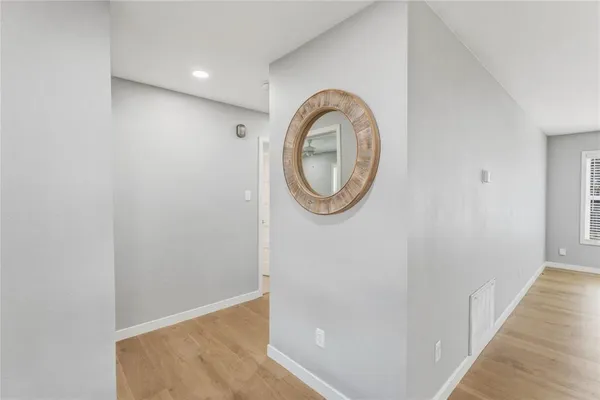 a view of a hallway with washer and dryer
