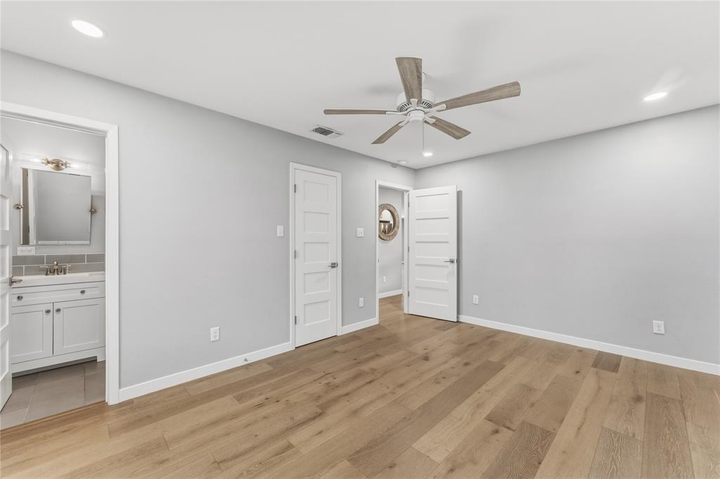 4600 Cedar Mountain Drive Waco, TX 76708 - Photo 23 of 40 a view of empty room with wooden floor and ceiling fan
