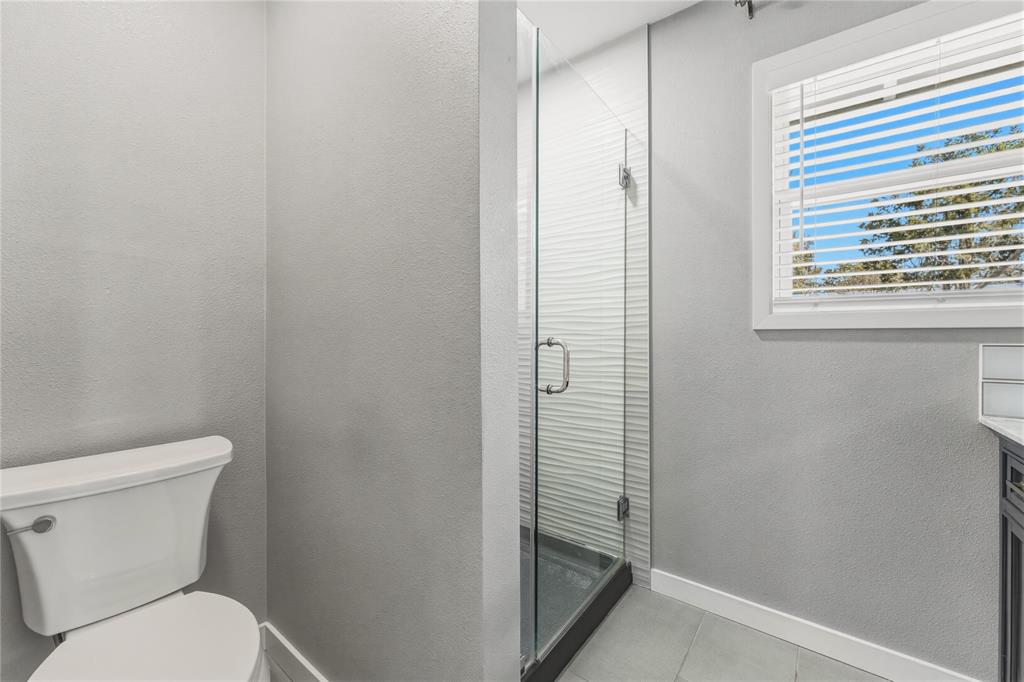 4600 Cedar Mountain Drive Waco, TX 76708 - Photo 31 of 40 a bathroom with a toilet and a shower