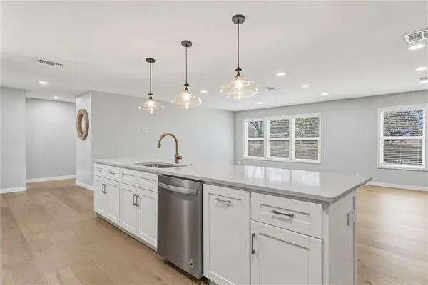 a center kitchen with sink and window