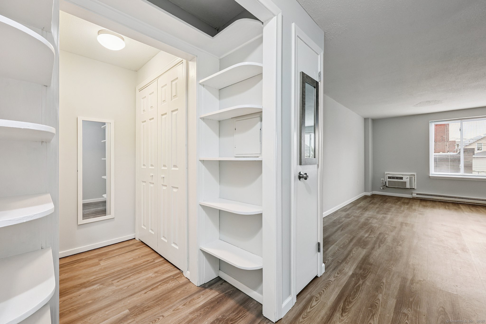 356 Franklin Avenue, Unit A4 Hartford, CT 06114 - Photo 11 of 21 a view of a room with wooden floor and windows