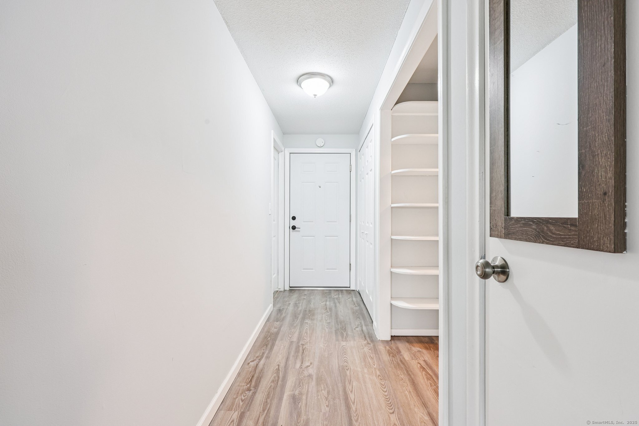356 Franklin Avenue, Unit A4 Hartford, CT 06114 - Photo 12 of 21 a view of a hallway with wooden floor and closet