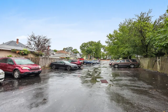 a view of street with parked cars
