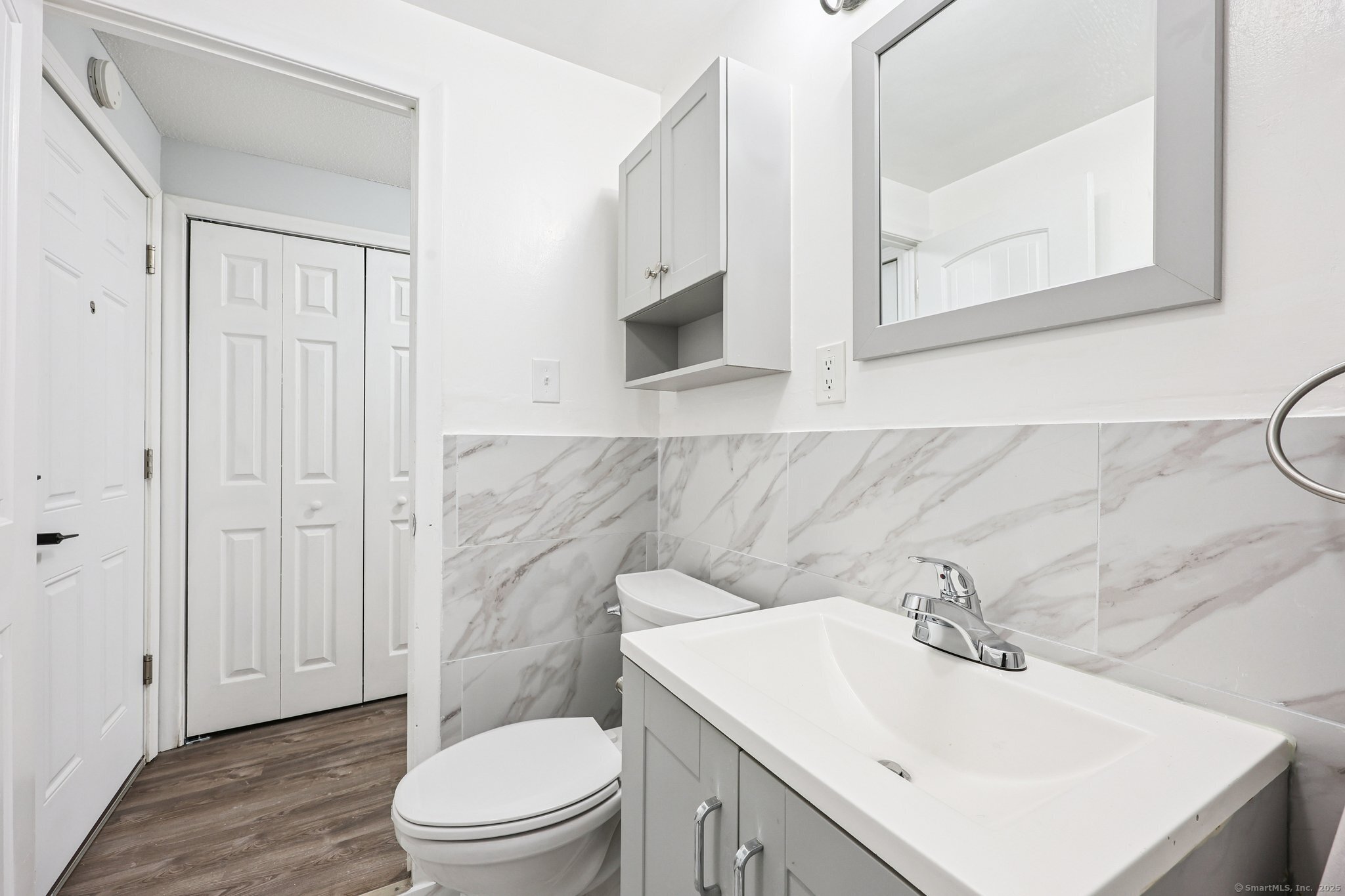 356 Franklin Avenue, Unit A4 Hartford, CT 06114 - Photo 9 of 21 a bathroom with a sink toilet and vanity