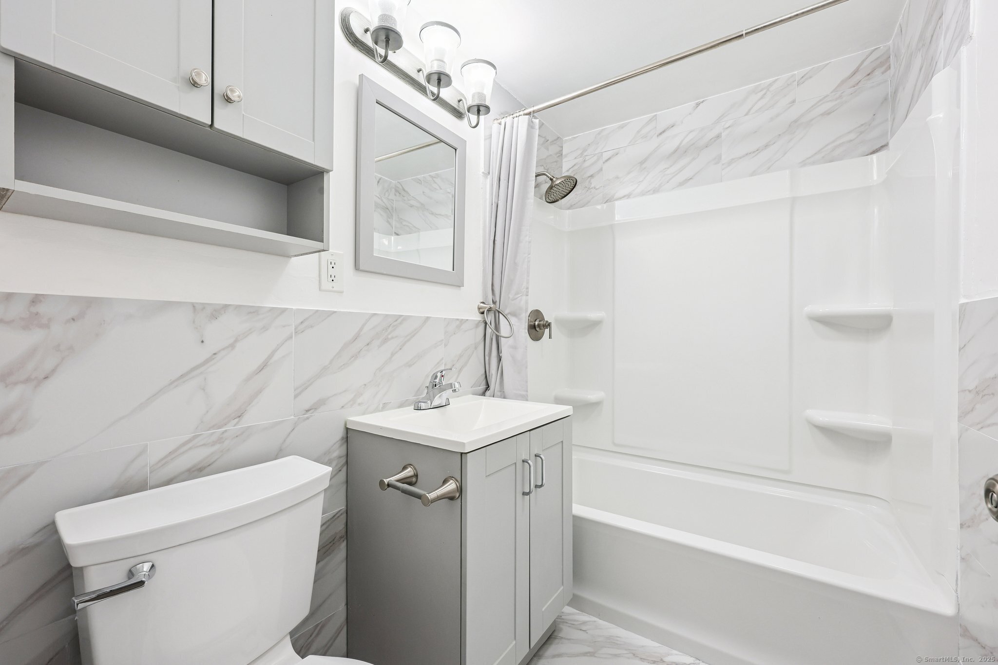 356 Franklin Avenue, Unit A4 Hartford, CT 06114 - Photo 10 of 21 a bathroom with a sink a toilet and shower