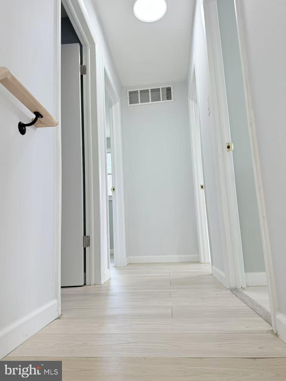 4529 Robin Road Newfield, NJ 08344 - Photo 13 of 39 a view of a hallway with wooden floor