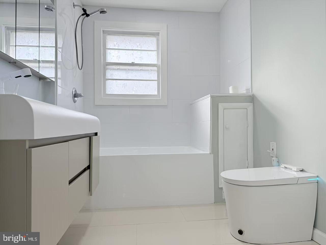 4529 Robin Road Newfield, NJ 08344 - Photo 15 of 39 a bathroom with a toilet sink and mirror