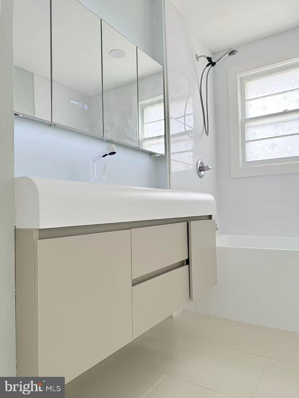 4529 Robin Road Newfield, NJ 08344 - Photo 16 of 39 a bathroom with a bathtub and a shower