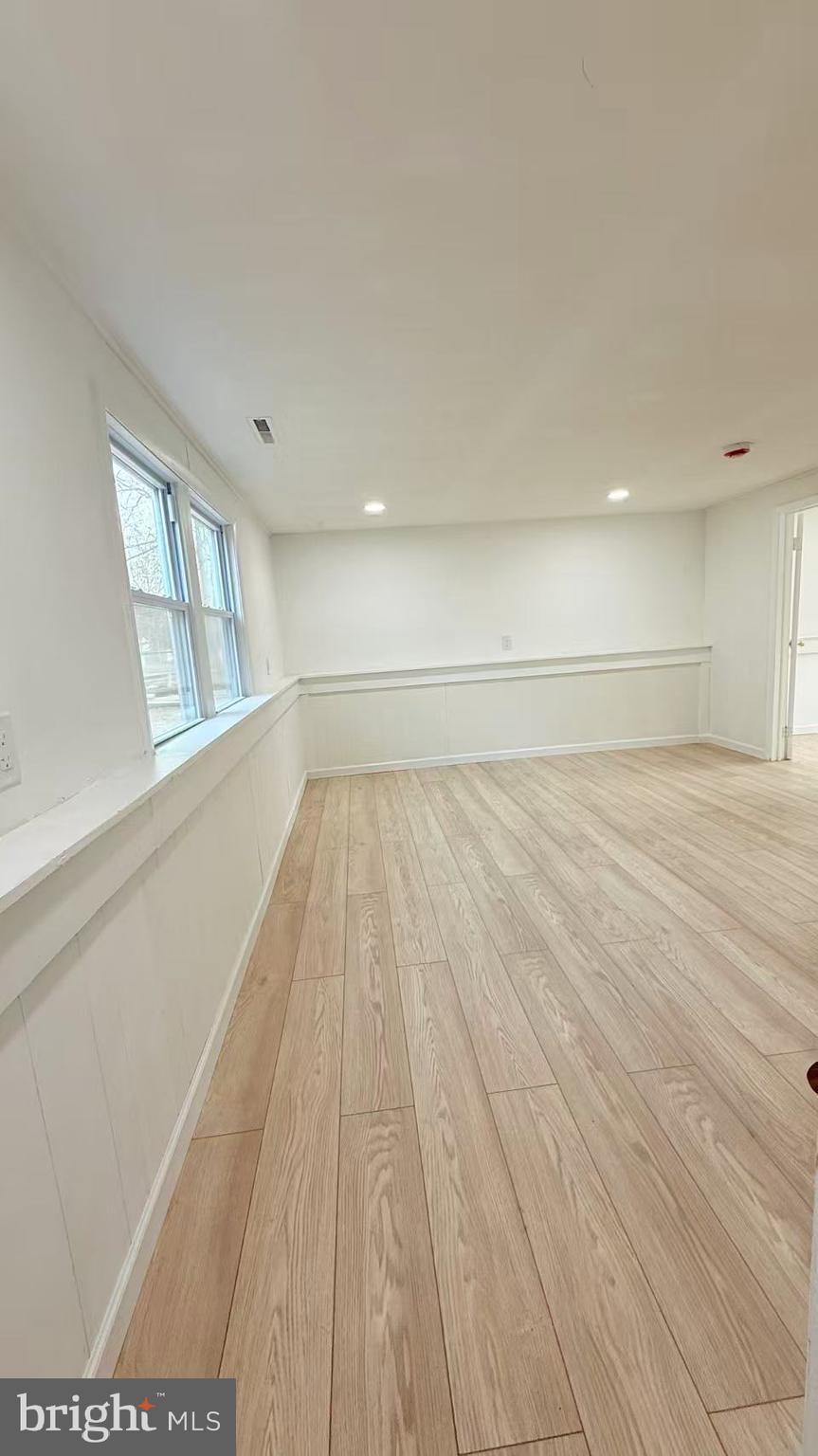 4529 Robin Road Newfield, NJ 08344 - Photo 26 of 39 a view of empty room with wooden floor and fan
