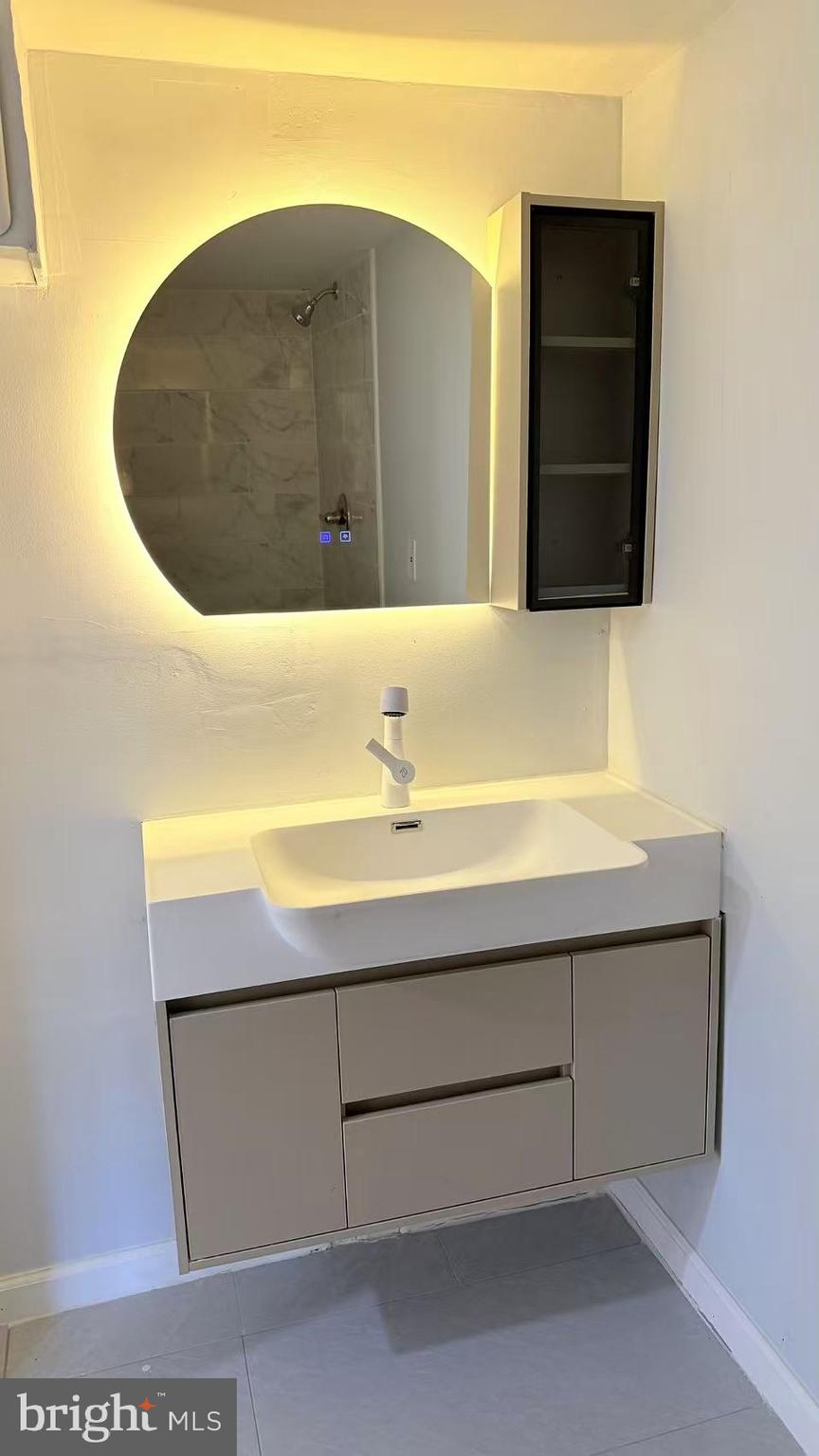 4529 Robin Road Newfield, NJ 08344 - Photo 33 of 39 a bathroom with a sink and a mirror