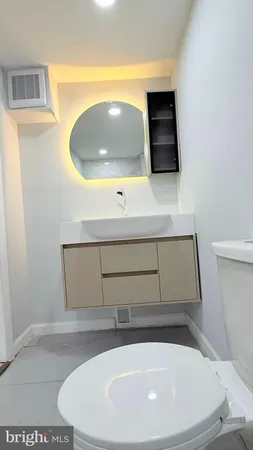 a bathroom with a sink and mirror