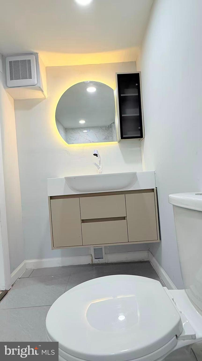4529 Robin Road Newfield, NJ 08344 - Photo 34 of 39 a bathroom with a sink and mirror