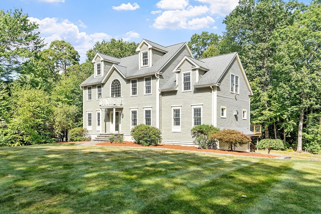 19 Barton Road Harvard, MA 01451 - Photo 1 of 20 a front view of a house with a garden