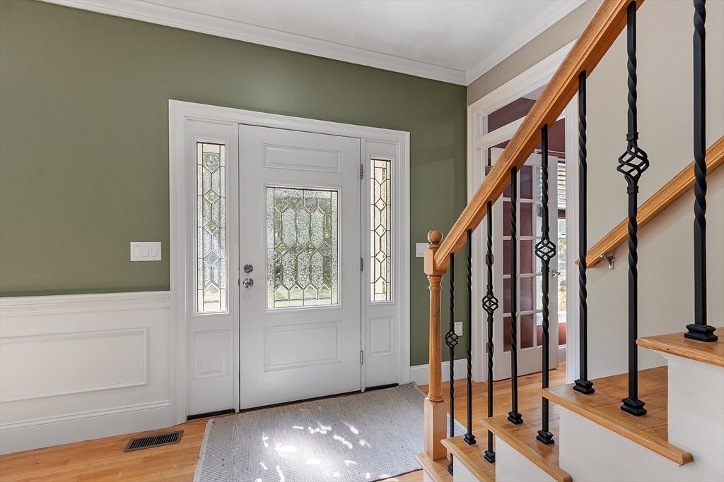 19 Barton Road Harvard, MA 01451 - Photo 11 of 20 a view of an entryway with wooden floor and door