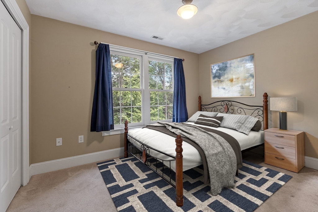 19 Barton Road Harvard, MA 01451 - Photo 13 of 20 a bed sitting in a bedroom next to a window