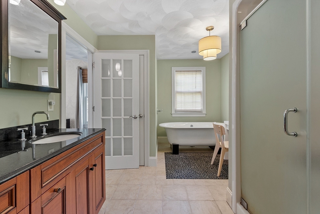 19 Barton Road Harvard, MA 01451 - Photo 16 of 20 a bathroom with a sink a vanity and a mirror