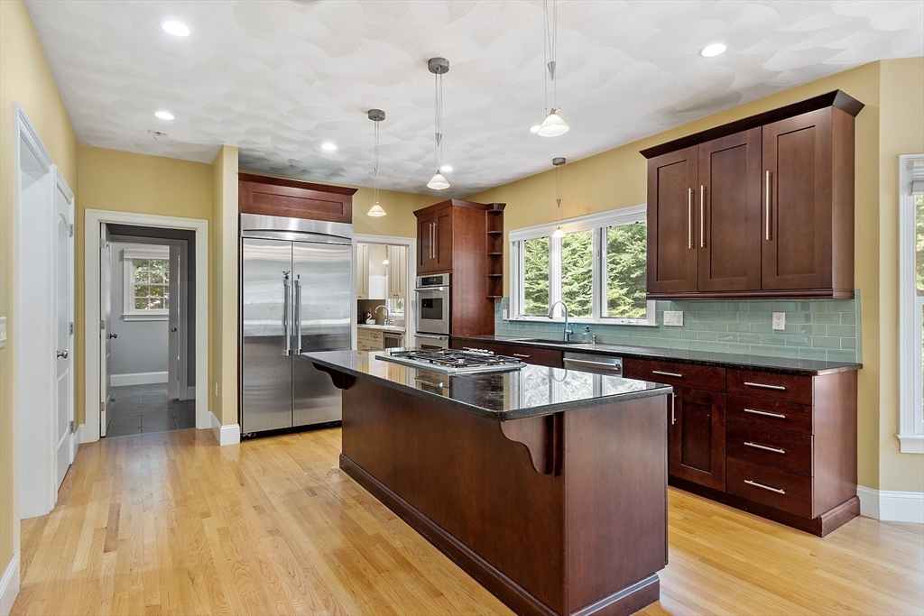 19 Barton Road Harvard, MA 01451 - Photo 2 of 20 a kitchen with stainless steel appliances granite countertop a sink a stove and a refrigerator