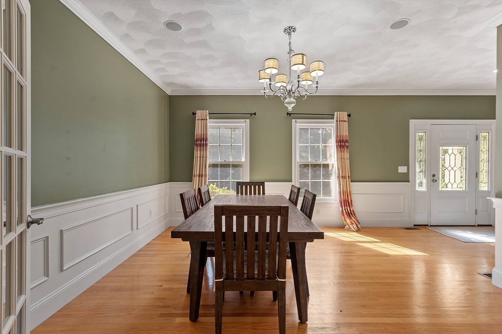19 Barton Road Harvard, MA 01451 - Photo 5 of 20 a view of a dining room with furniture a chandelier and wooden floor