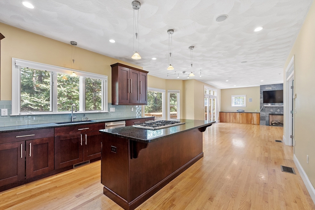 19 Barton Road Harvard, MA 01451 - Photo 7 of 20 a kitchen with stainless steel appliances granite countertop a stove and a wooden floors
