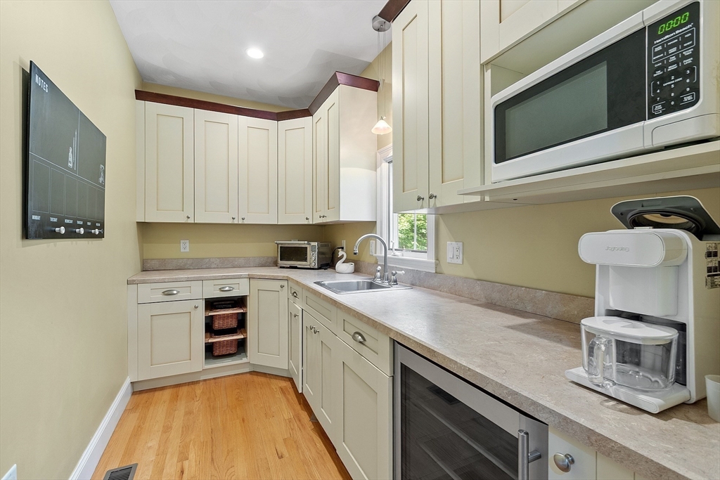 19 Barton Road Harvard, MA 01451 - Photo 9 of 20 a kitchen with a sink cabinets and stainless steel appliances