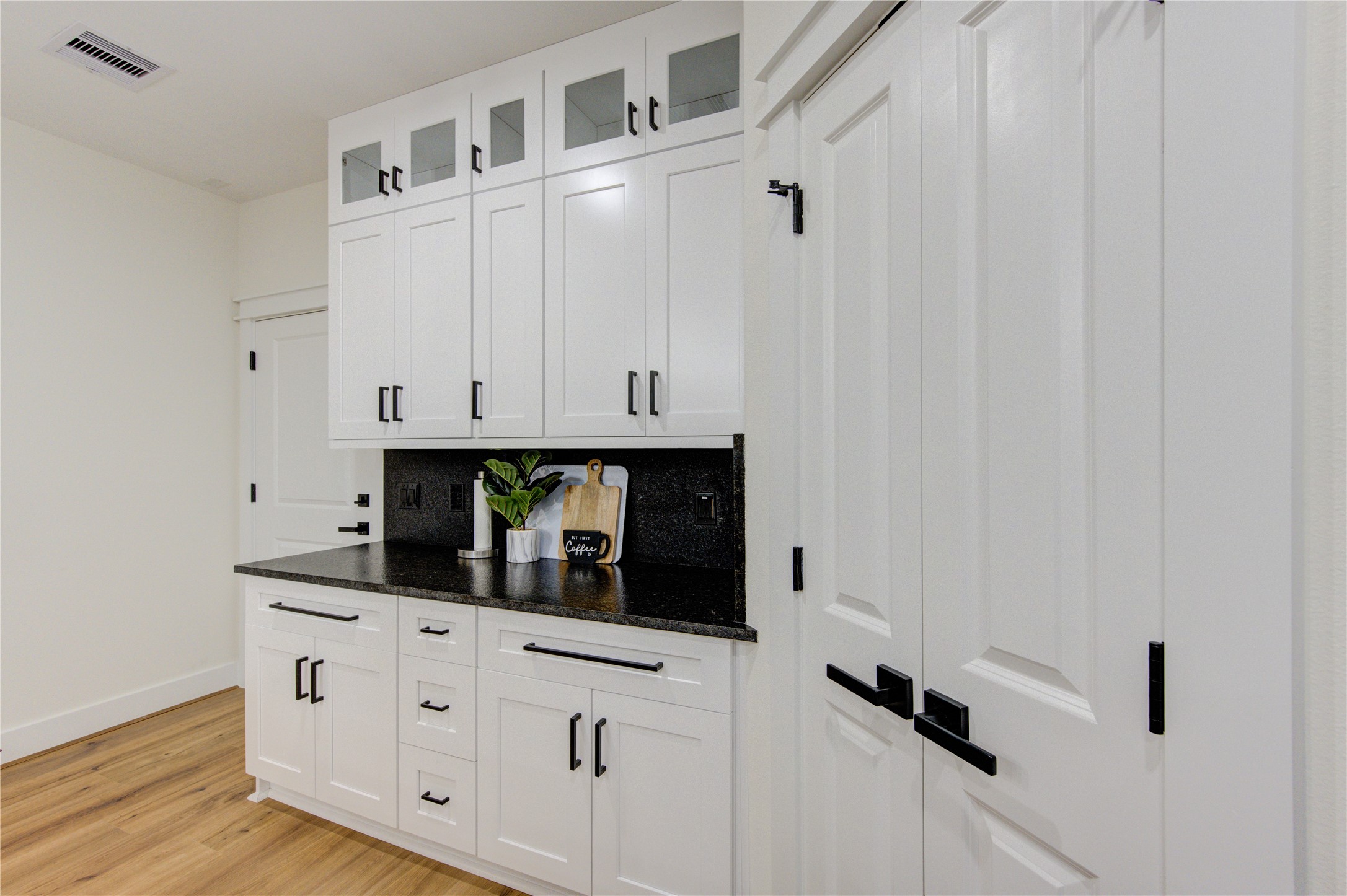 3406 Garapan Street, Unit A Houston, TX 77091 - Photo 18 of 44 a view of cabinets and wooden floor