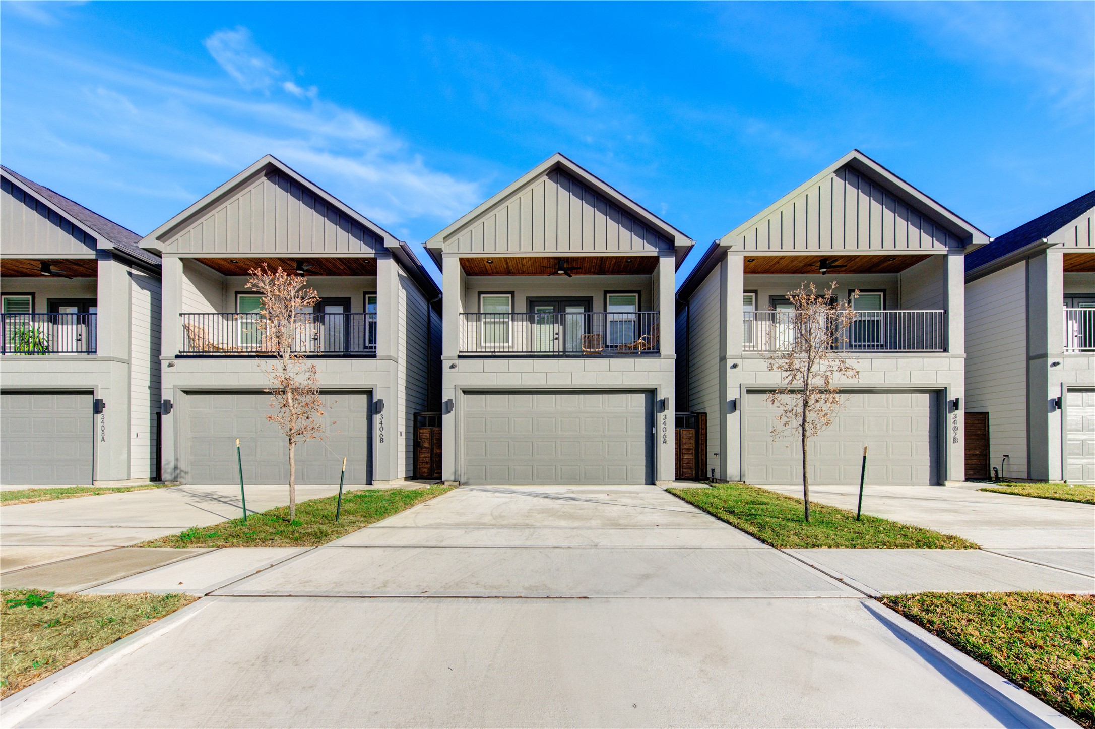 3406 Garapan Street, Unit A Houston, TX 77091 - Photo 2 of 44 a front view of a house with a yard and garage
