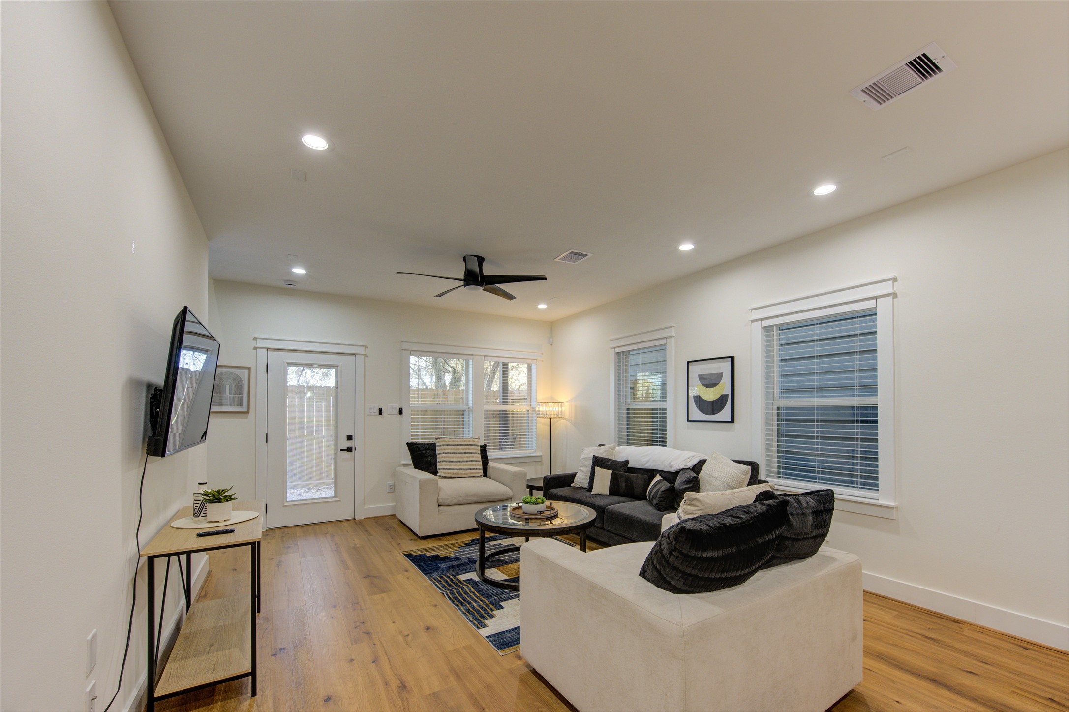 3406 Garapan Street, Unit A Houston, TX 77091 - Photo 21 of 44 a living room with furniture and a flat screen tv