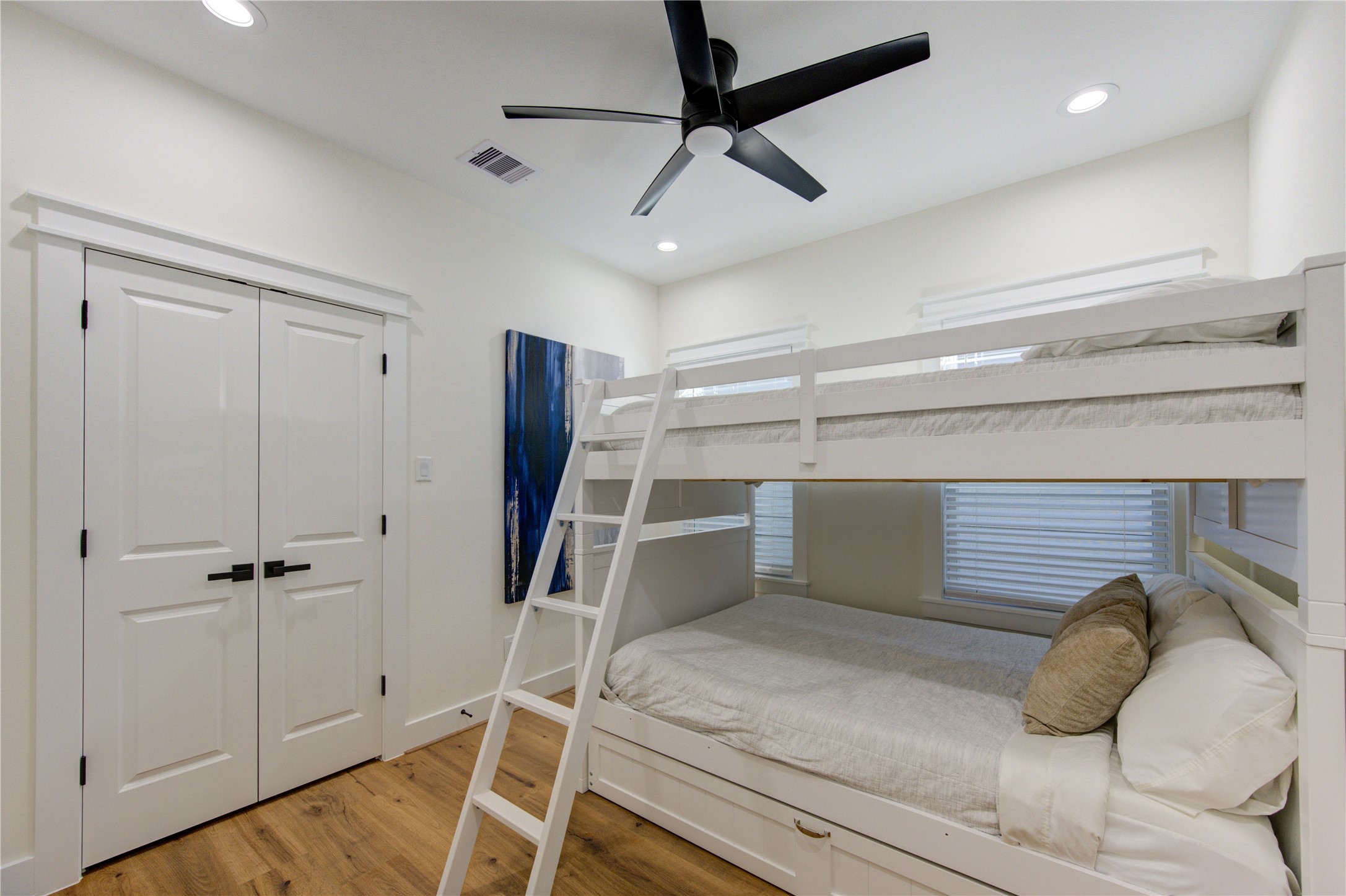 3406 Garapan Street, Unit A Houston, TX 77091 - Photo 31 of 44 a bedroom with a bed and a ceiling fan