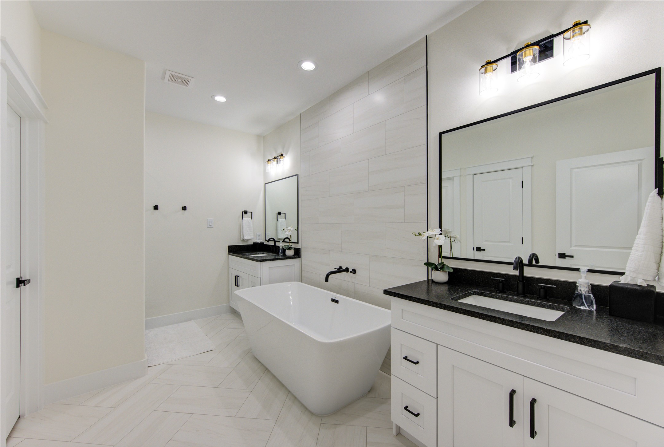 3406 Garapan Street, Unit A Houston, TX 77091 - Photo 34 of 44 a spacious bathroom with sinks and mirror