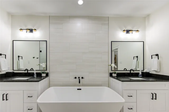 a bathroom with a bathtub and a sink