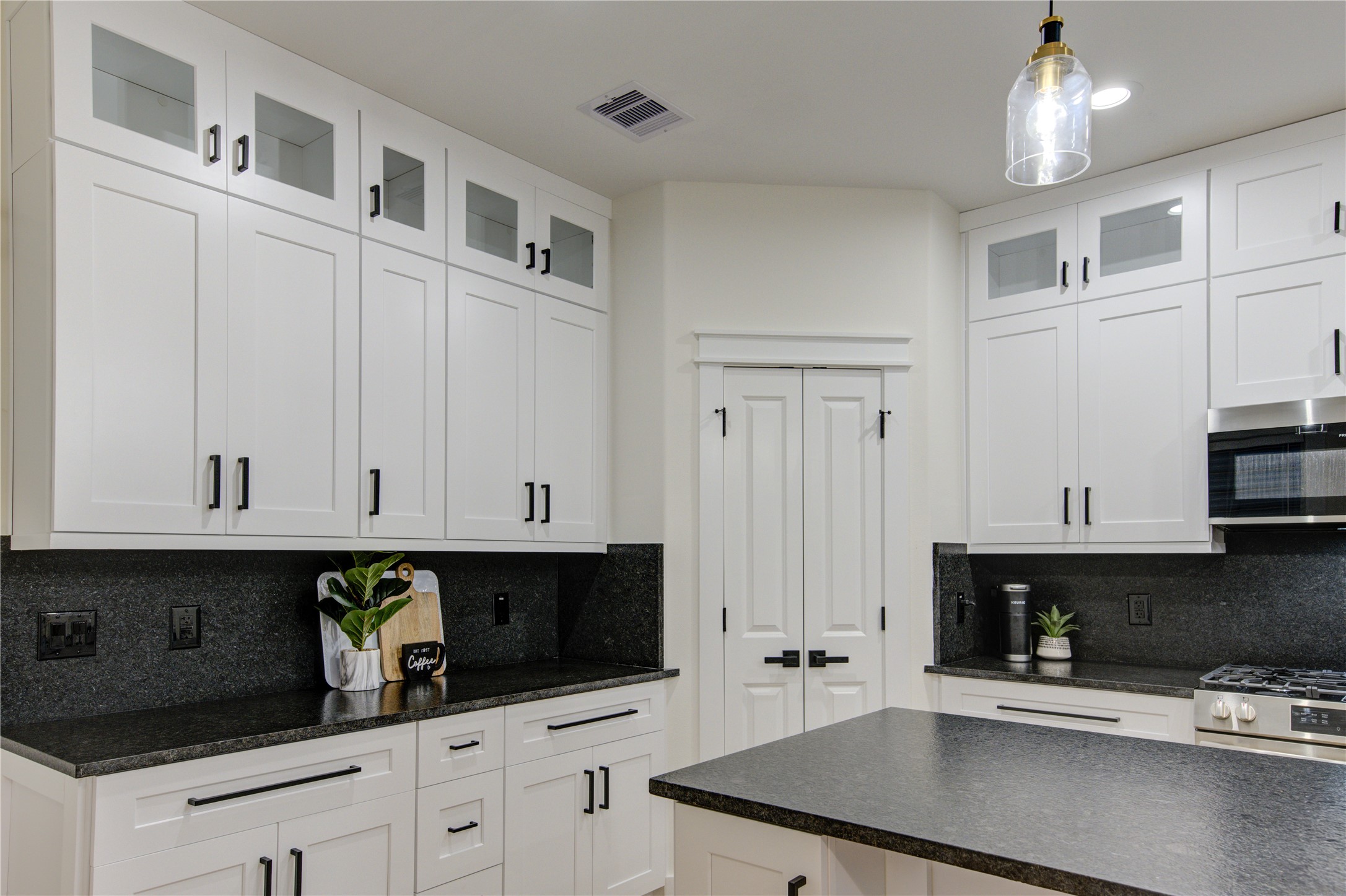 3406 Garapan Street, Unit A Houston, TX 77091 - Photo 7 of 44 a kitchen with stainless steel appliances white cabinets and a sink