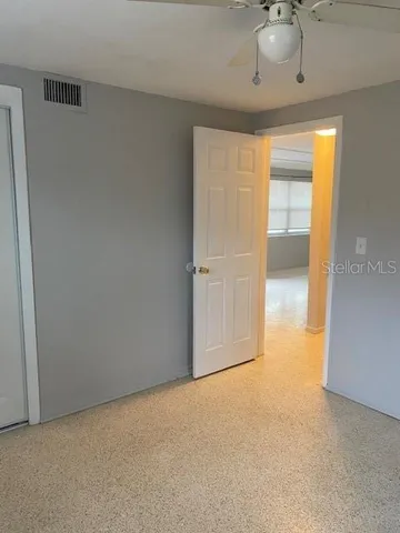 a view of an empty room with a window