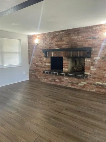 a view of fireplace and wooden floor