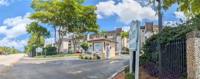 a view of a street with a building in the background