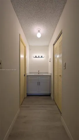 a view of a room with furniture and a window