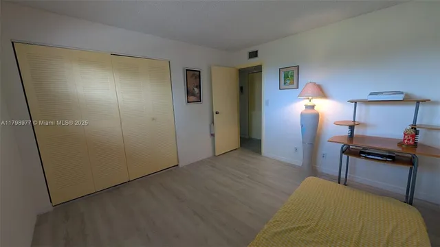a kitchen with granite countertop a stove top oven and cabinets