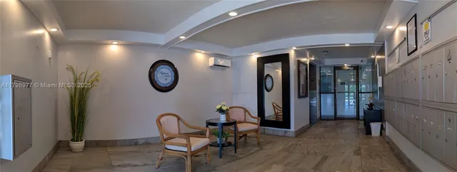 a view of a hallway with entryway wooden floor and front door