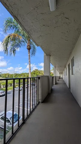a view of a city street with cars