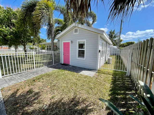 a front view of a house with a yard and porch