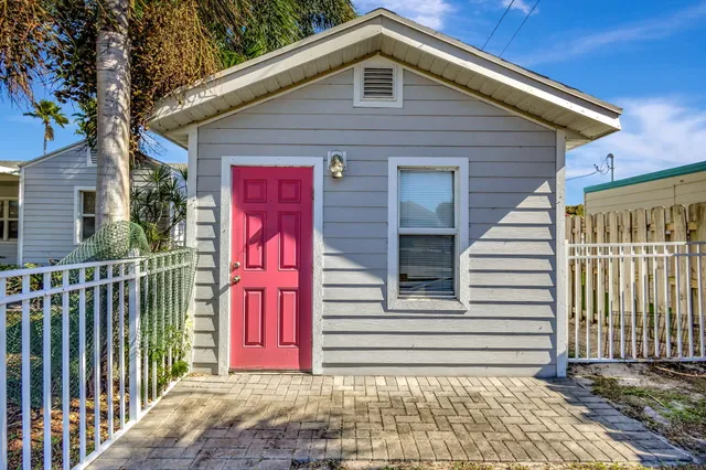 an aerial view of residential houses with outdoor space and swimming pool