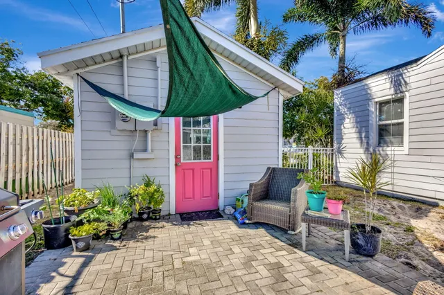 an aerial view of a houses with a swimming pool