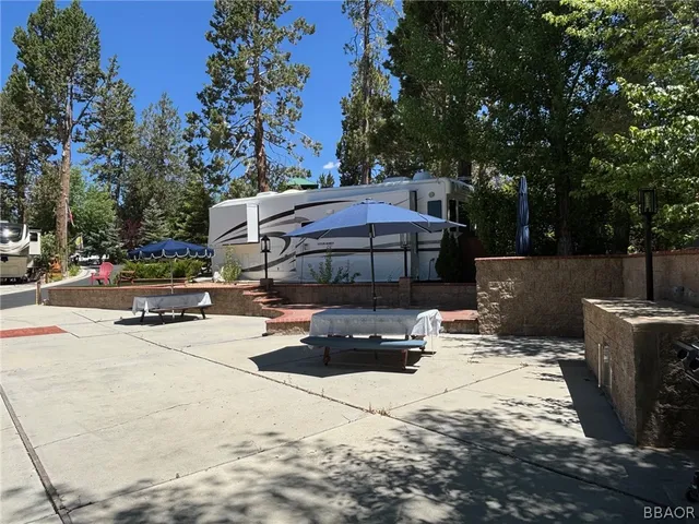 a street view with sitting space and trees