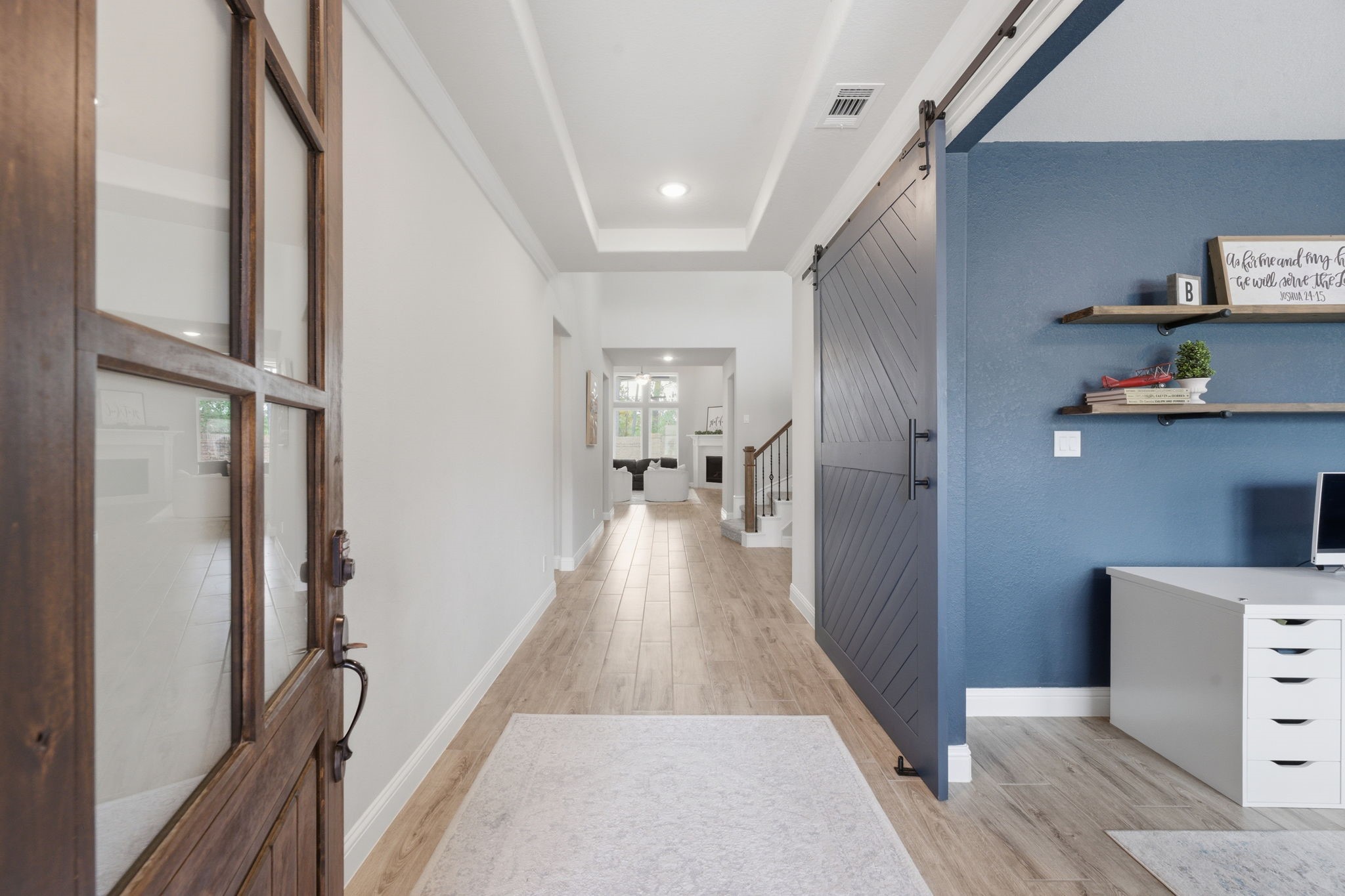 4242 Orchard Pass Drive Spring, TX 77386 - Photo 12 of 50 Gorgeous 8'Front Door Greets Your Guests as you enter into the Elongated Entryway w/ Woodlook Tile Flooring Flanked by Double Study with Barn Door