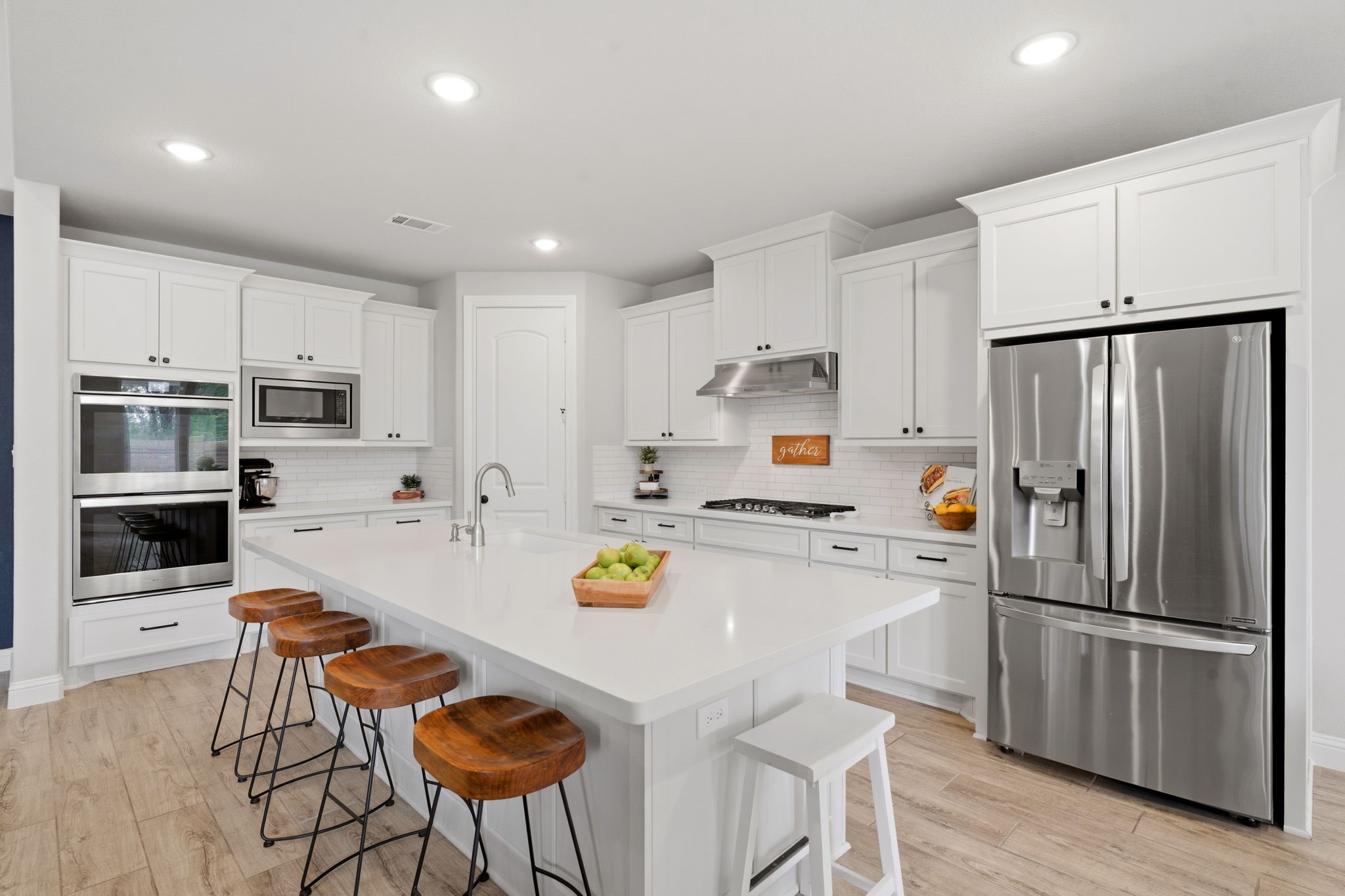 4242 Orchard Pass Drive Spring, TX 77386 - Photo 18 of 50 Imagine Daily Meals or Entertaining in this Chef's Dream Quartz Island Kitchen and an Amazing Wrap Around Corner Pantry