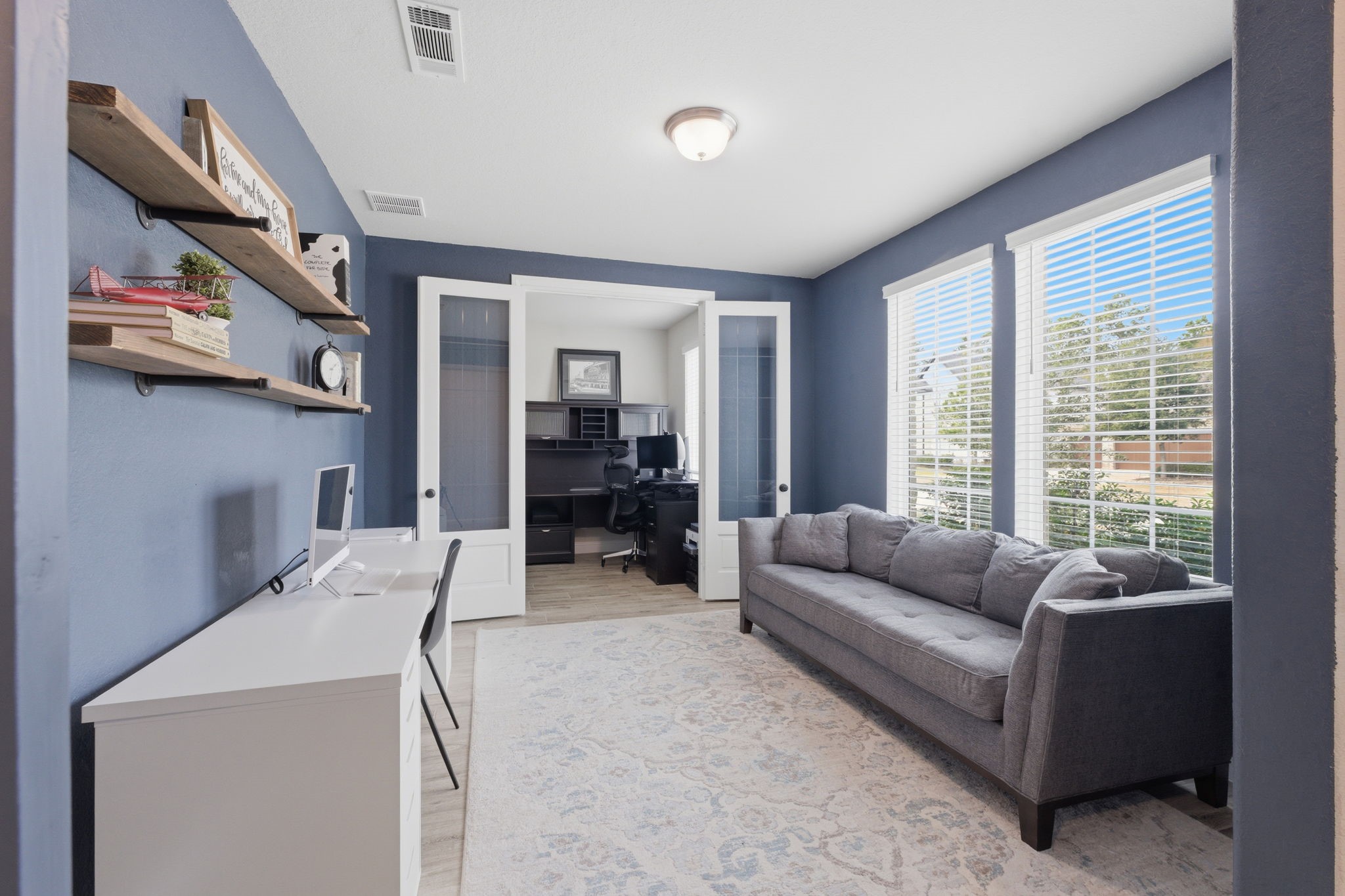 4242 Orchard Pass Drive Spring, TX 77386 - Photo 2 of 50 Barn Door Opens from Entry into Double Study w/Tile Woodlook Flooring, Bright Windows Overlooking Front Yard. Second Room w/ French Doors is about 8' x 8'.